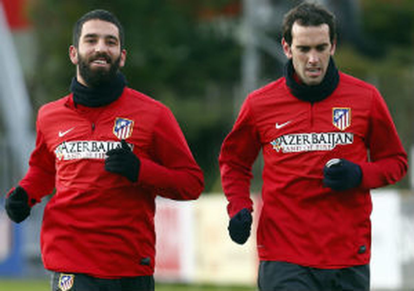 Arda Turan y Godín