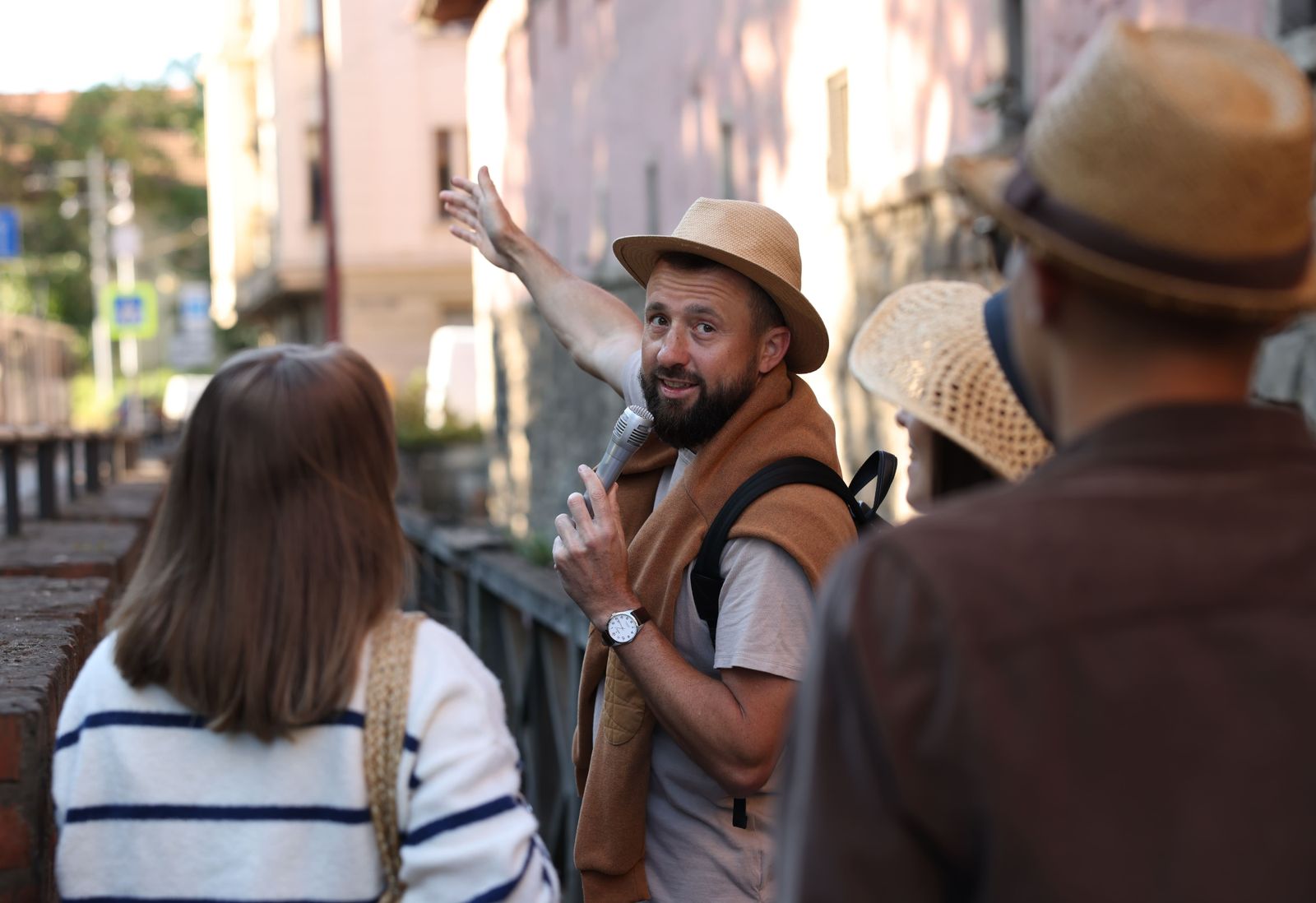 guide-with-microphone-and-tourists-on-city-street-2026-05-07-06-22-38-utc (1)