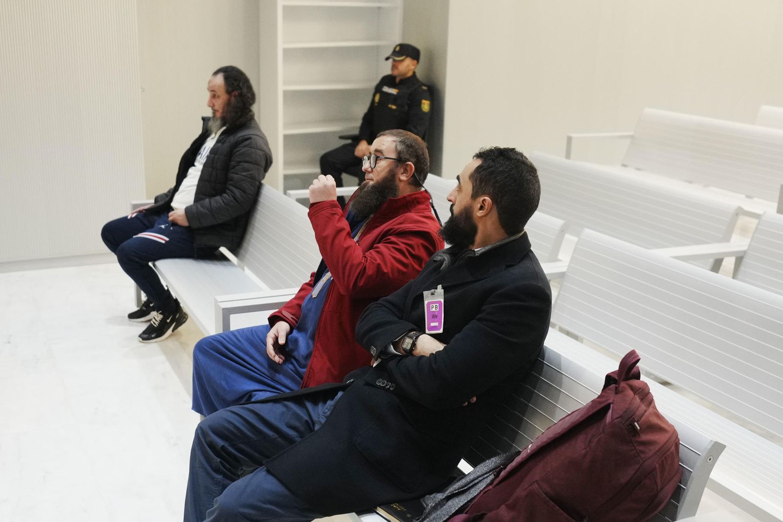 Mohamed El Gharbi, Karim Abdeselam Mohamed y Abdelah Abdeselam Ahmed se sientan en el banquillo de los acusados durante su juicio este lunes en la Audiencia Nacional