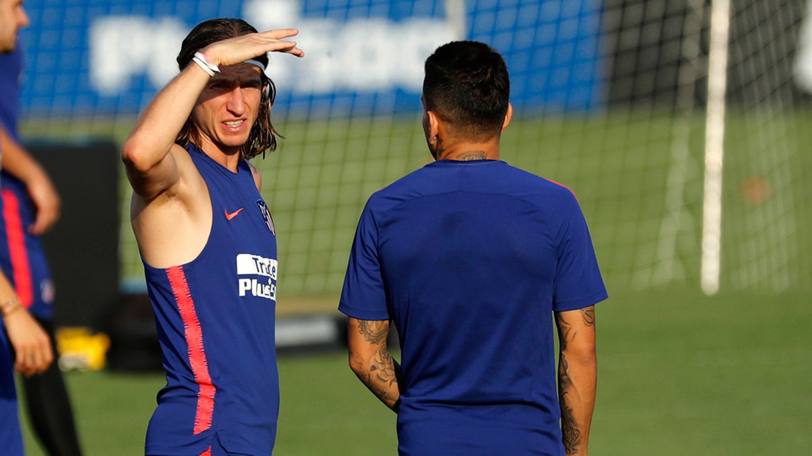 Filipe Luis junto Diego Simeone
