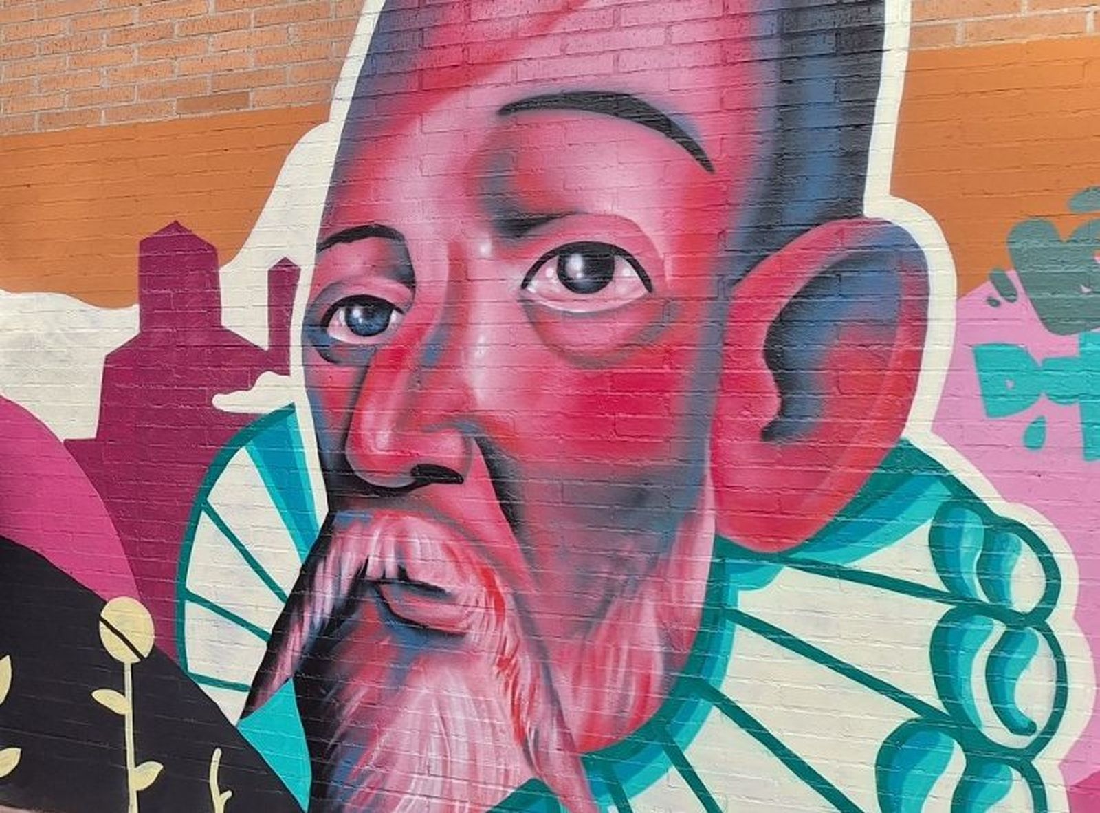 Mural de Cervantes en el CEIP Cervantes de Alcalá de Henares, obra de 'Dulce Toño'